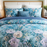 Angled shot of the midnight blue floral garden comforter set on a bed