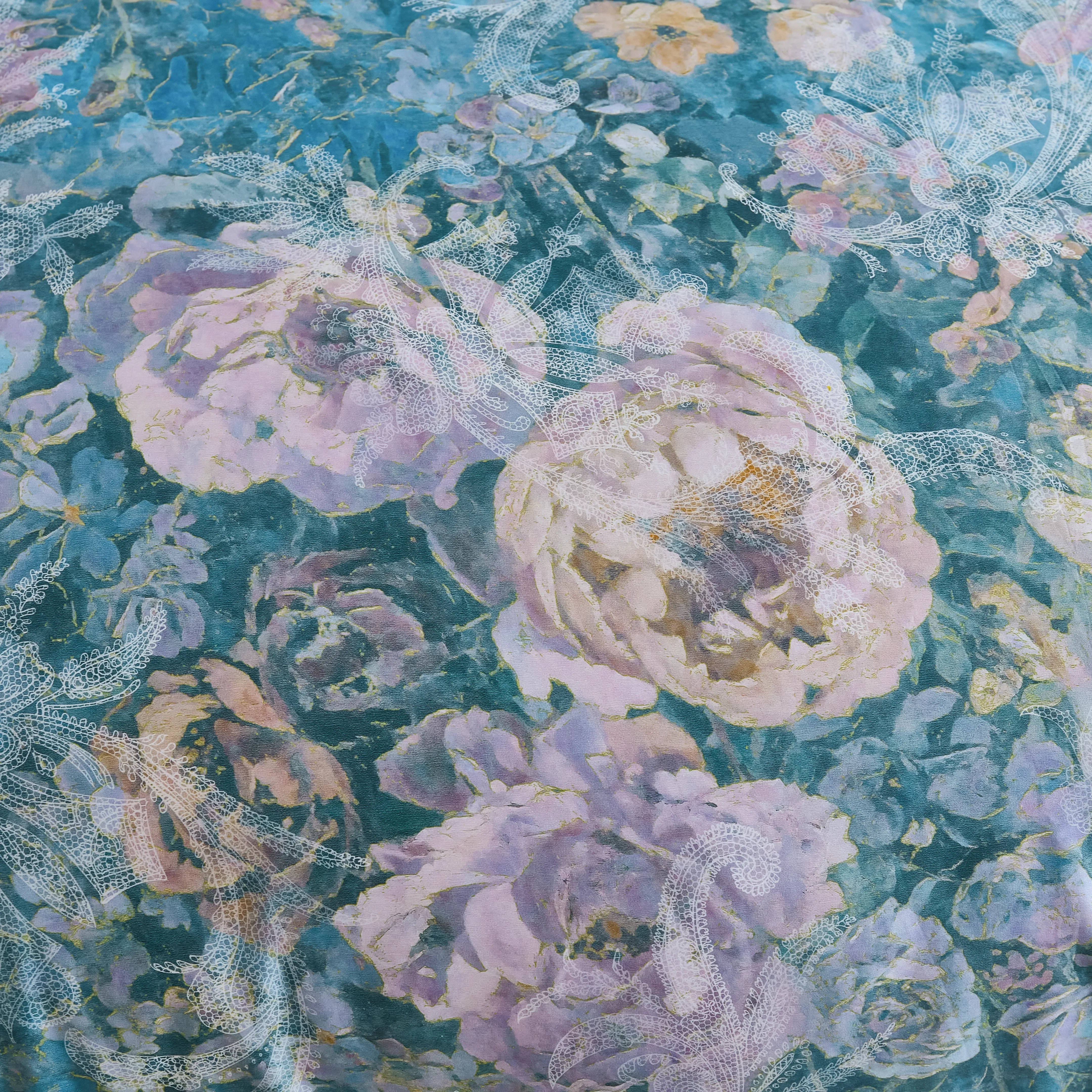 Detailed view of the midnight blue fabric and botanical pattern