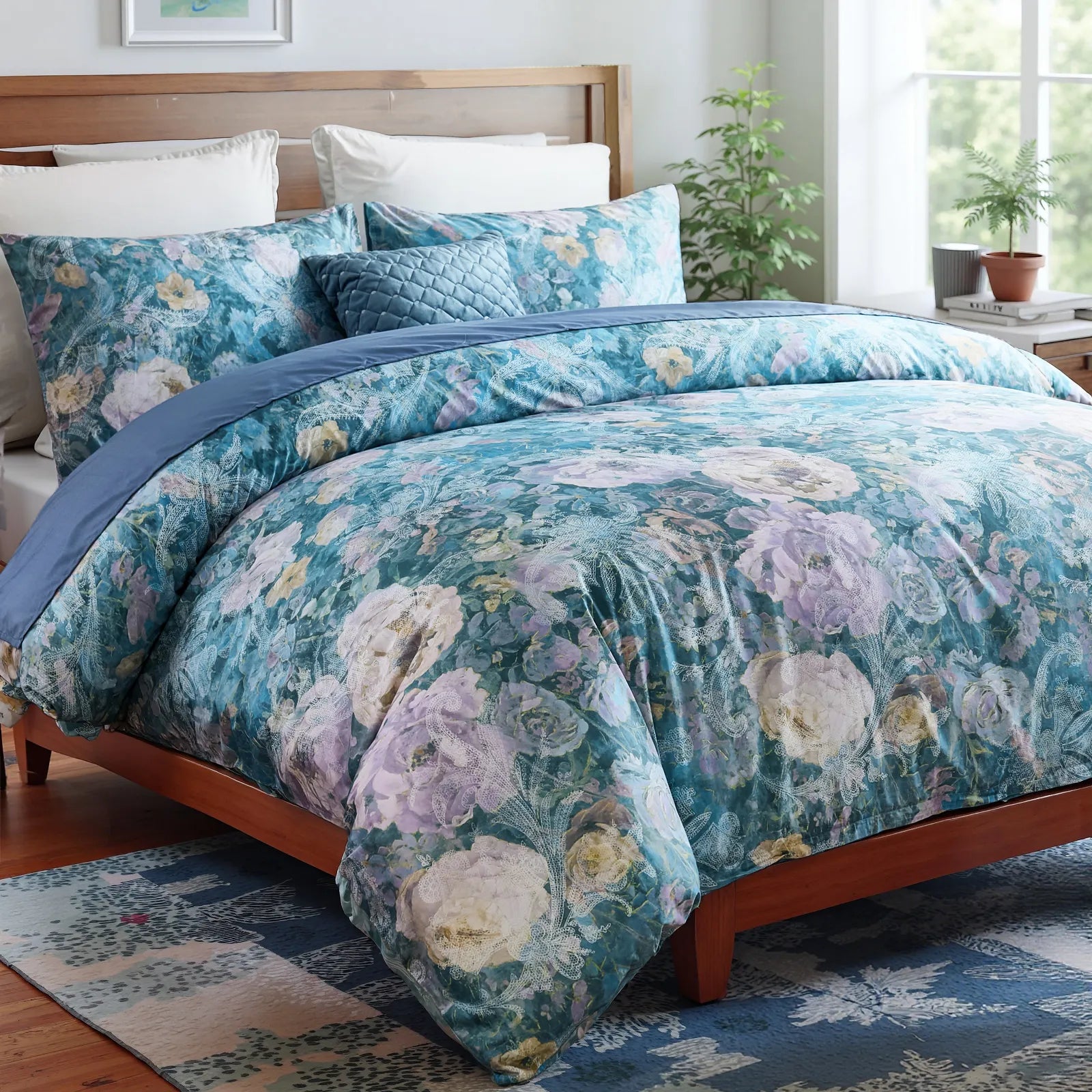 Full view of the midnight blue floral garden comforter set on a bed