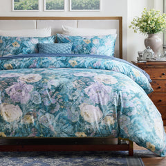 View of the floral comforter set styled in a light-colored bedroom