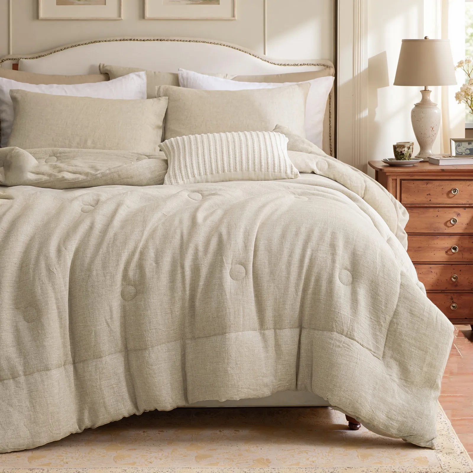 Natural linen pillowcases styled on a bed with beige bedding