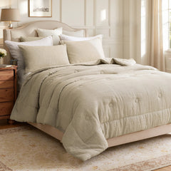 Side view of natural linen pillowcases placed on a bed with a beige comforter