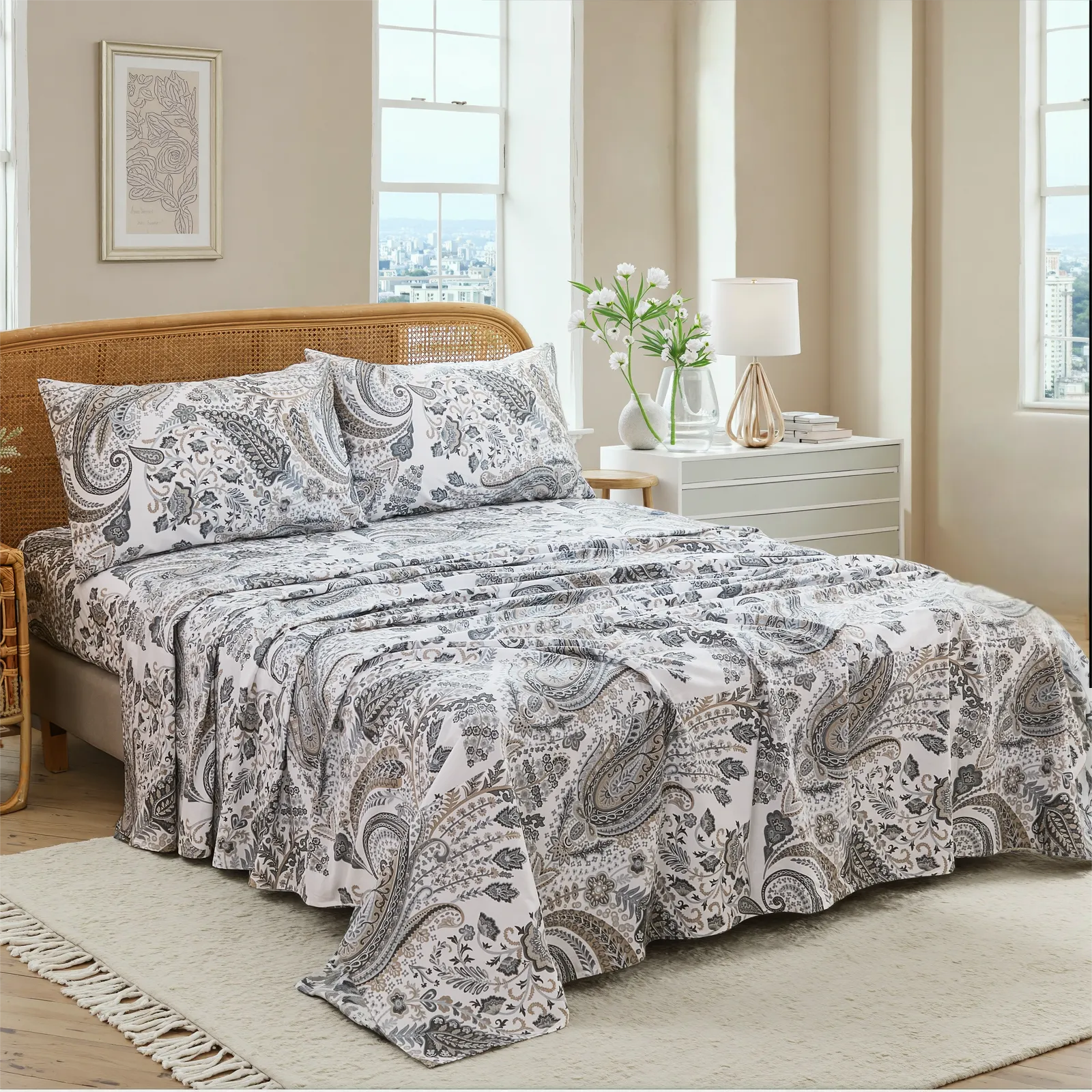 Close up detail of cotton neutral paisley print pillowcases and fitted sheet set