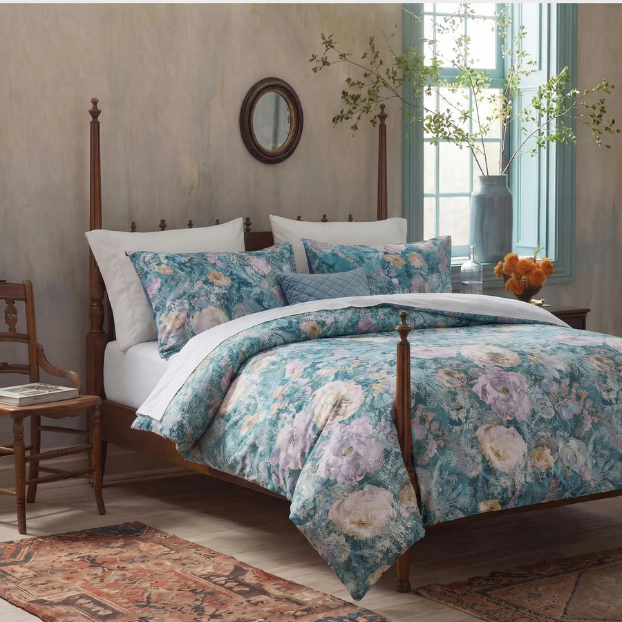moody teal floral duvet cover set with painterly lilac and cream blossoms in a rustic room