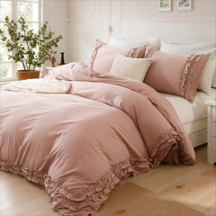 Pink cotton double ruffle duvet cover set with a textured pillow near a sunny window corner.