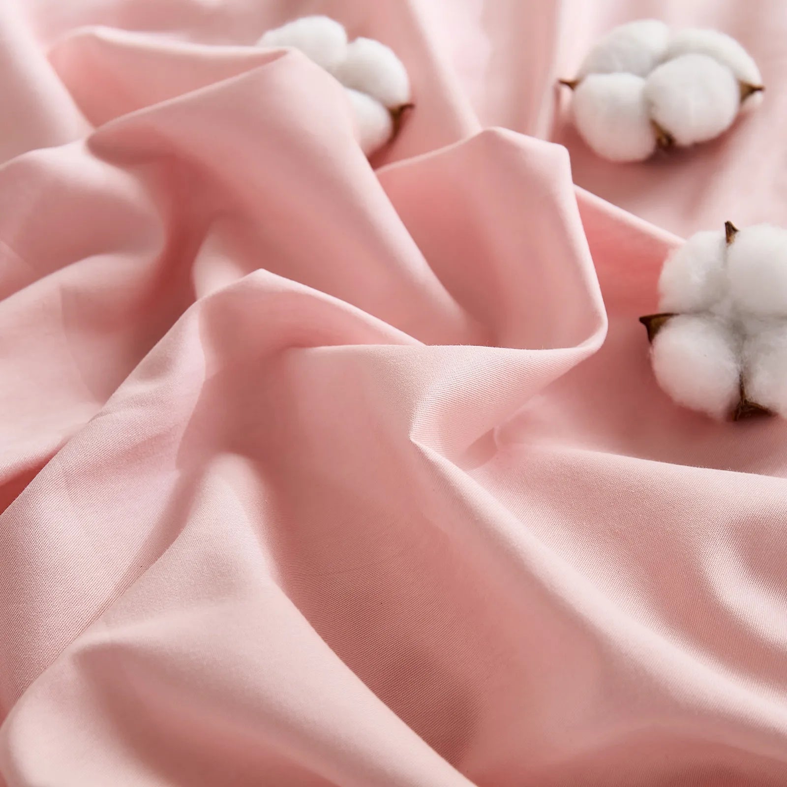Close-up of pink duvet showing cotton distribution on textured fabric