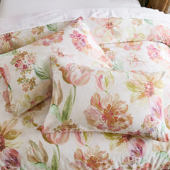 Top-down view of the pink floral comforter and pillow set