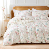 The pink flower duvet cover set styled in a cozy, modern bedroom.