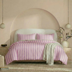Full front view of pink purple striped bedding set