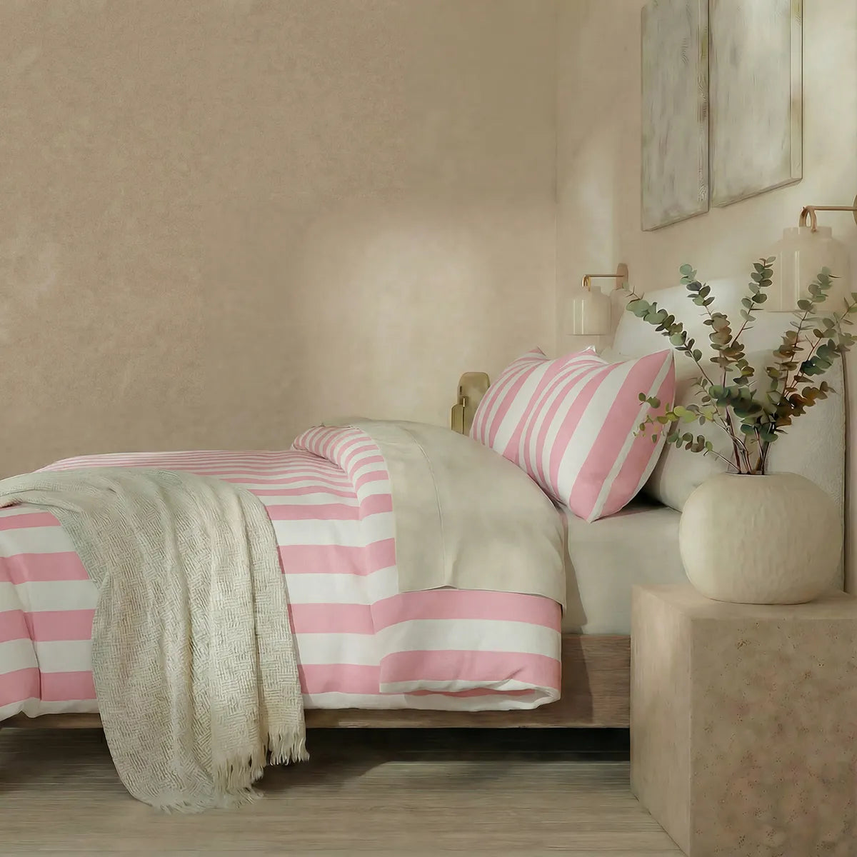 Side view of pink and white striped duvet and pillows