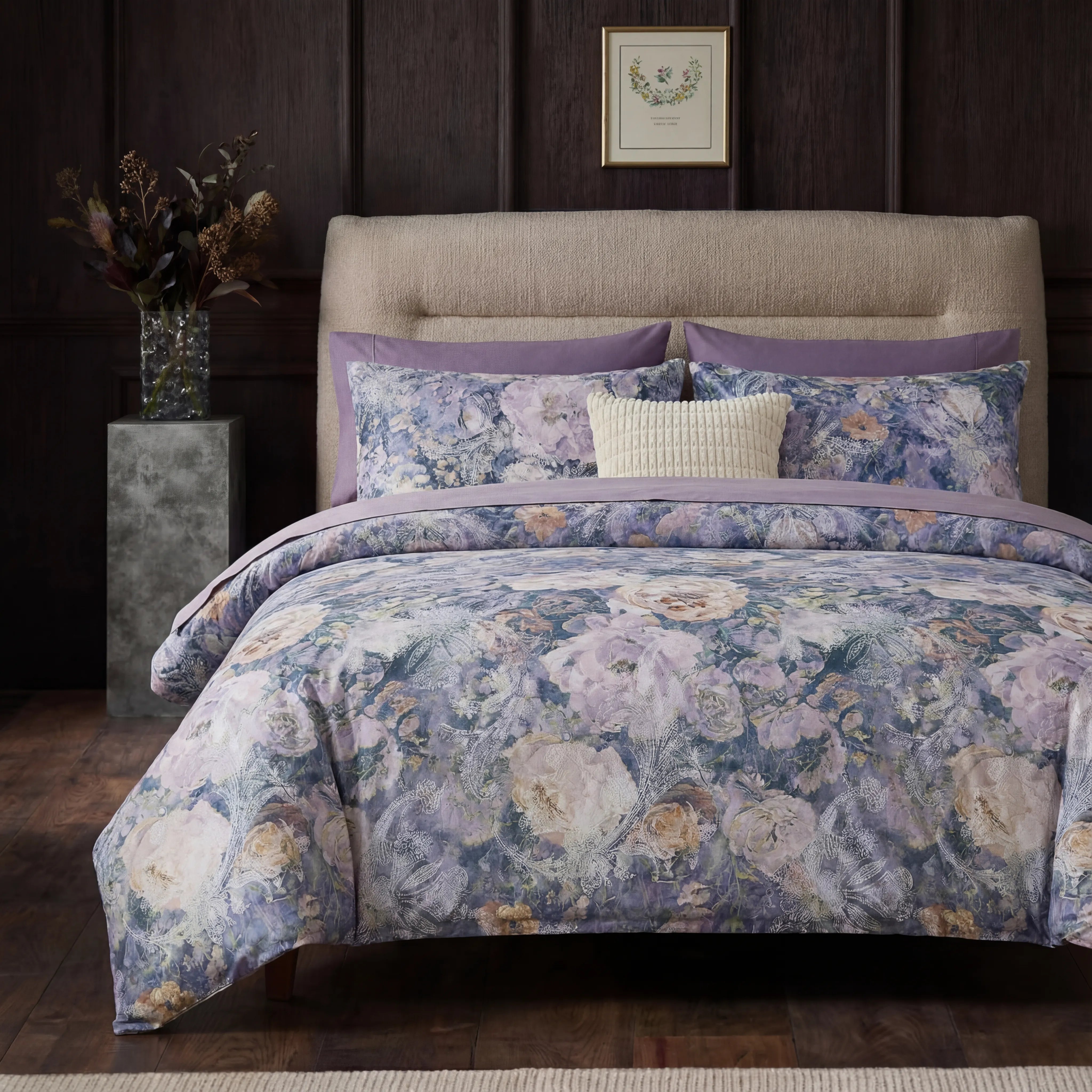 Front view of purple floral and lace duvet cover set on bed
