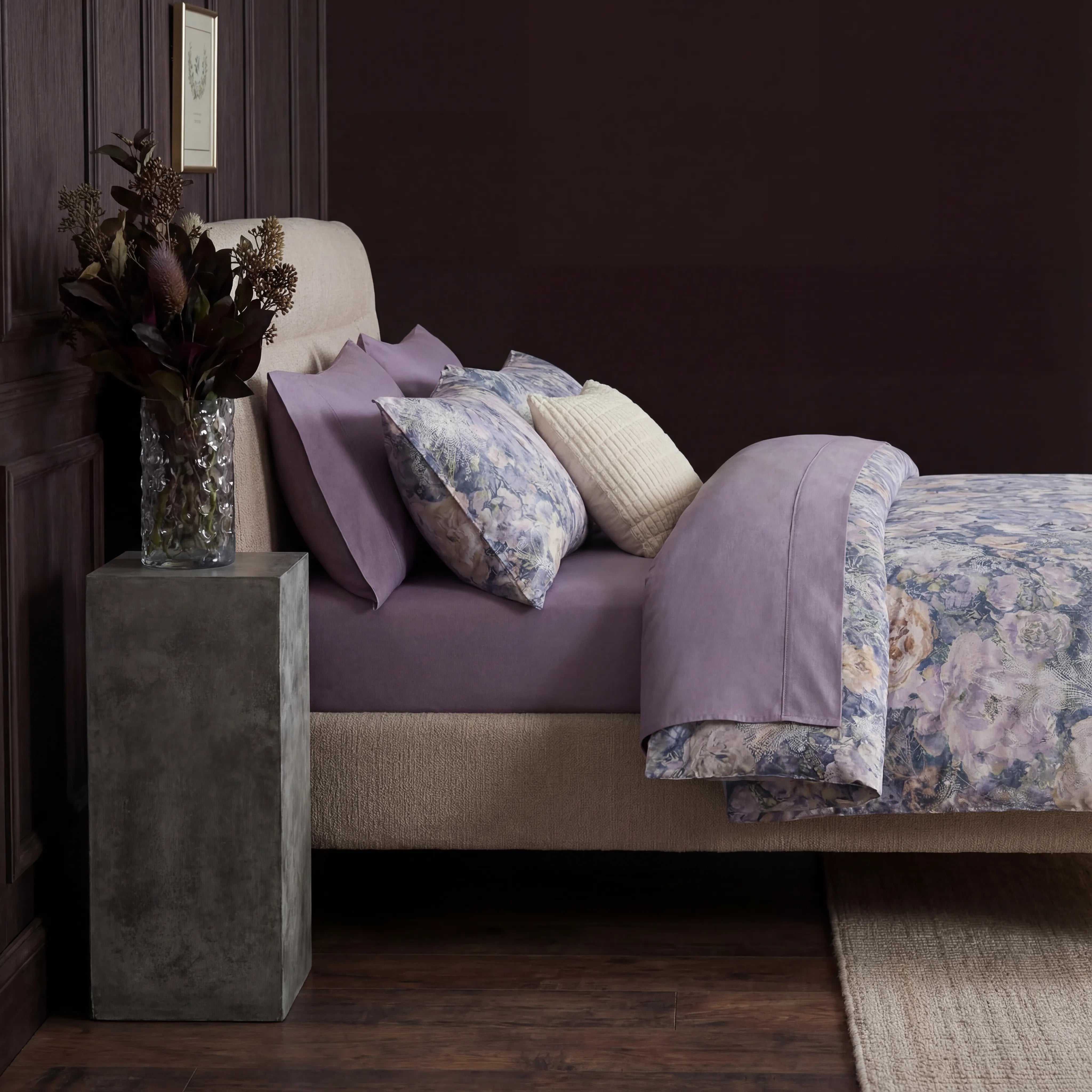 Front view of floral duvet with solid purple reverse side visible