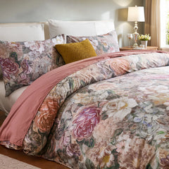 Angled shot of the retro bloom comforter set on the bed