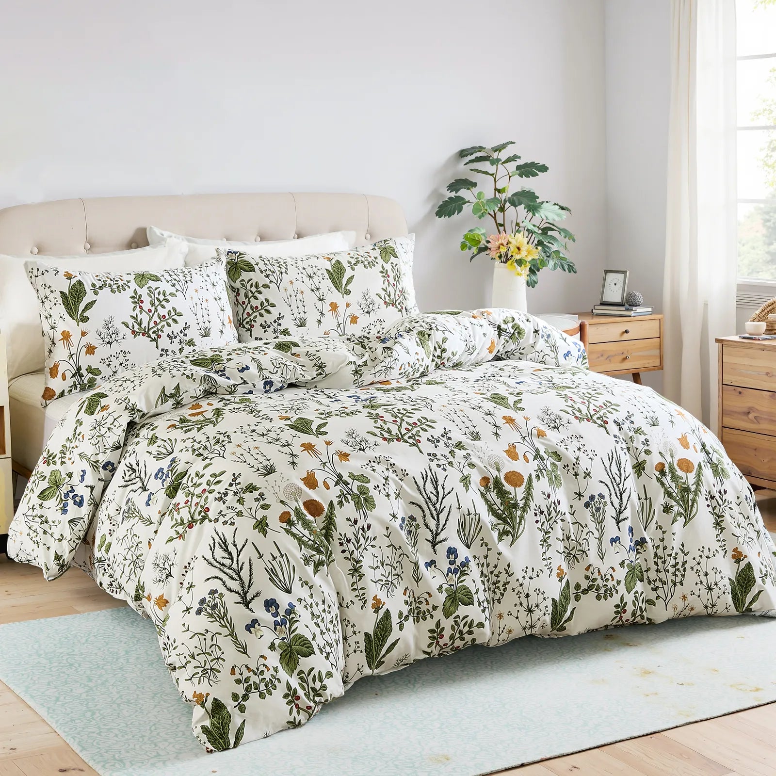 The sage green botanical bedding set styled in a bright, coastal bedroom