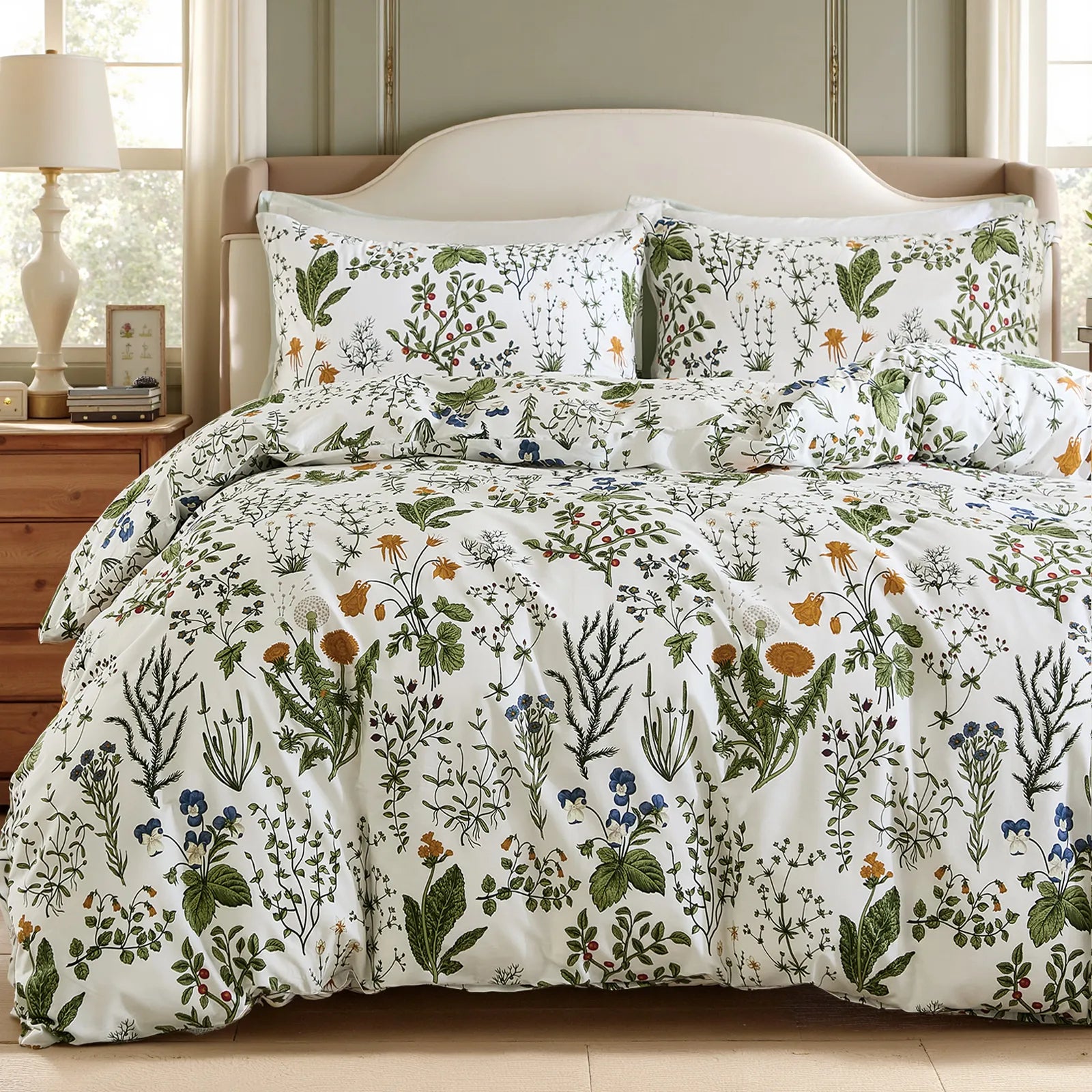Bed with white comforter featuring a botanical print with sage green and yellow flowers, in a rustic bedroom.