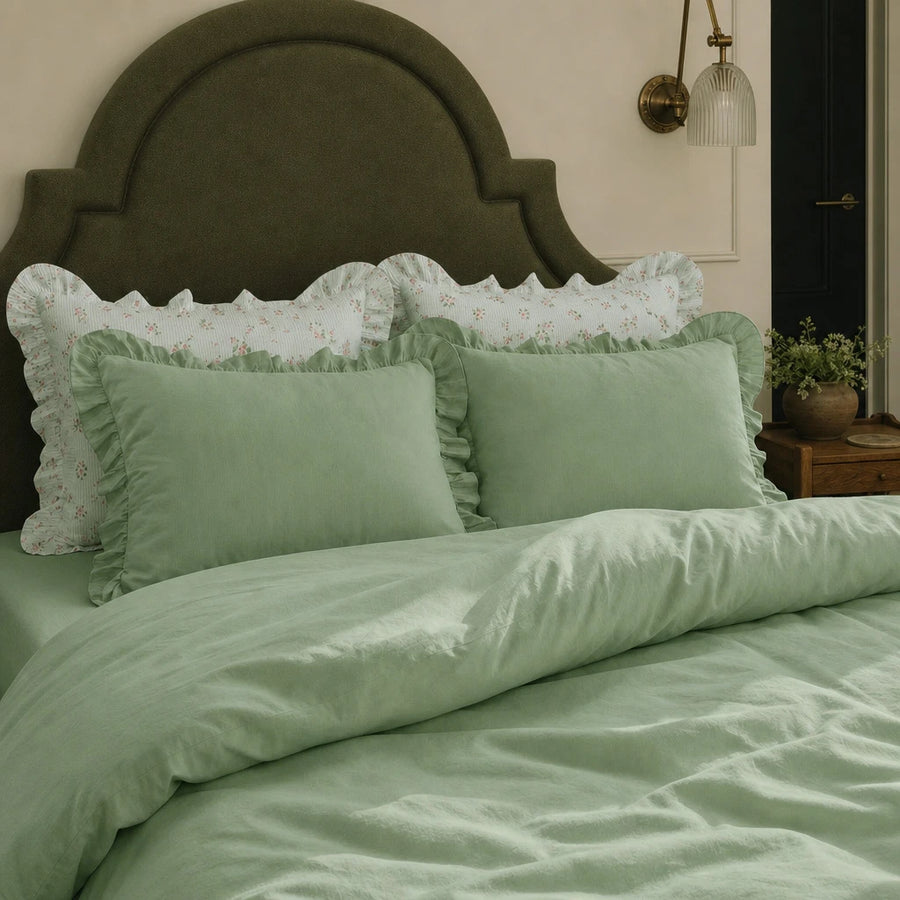 sage green ruffled pillow shams with floral accents