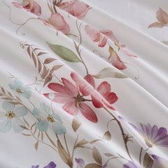 Detailed view of the watercolor floral and leaf pattern on the fabric