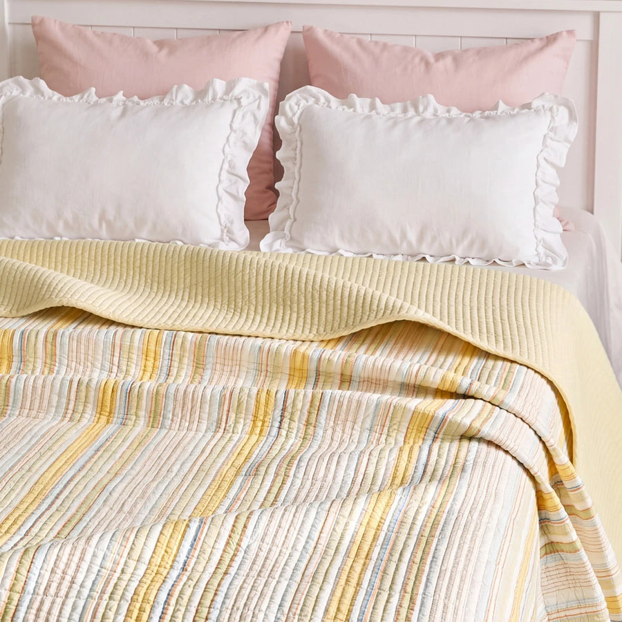 solace yarn dyed quilt butter solace white ruffled pink pillows headboard