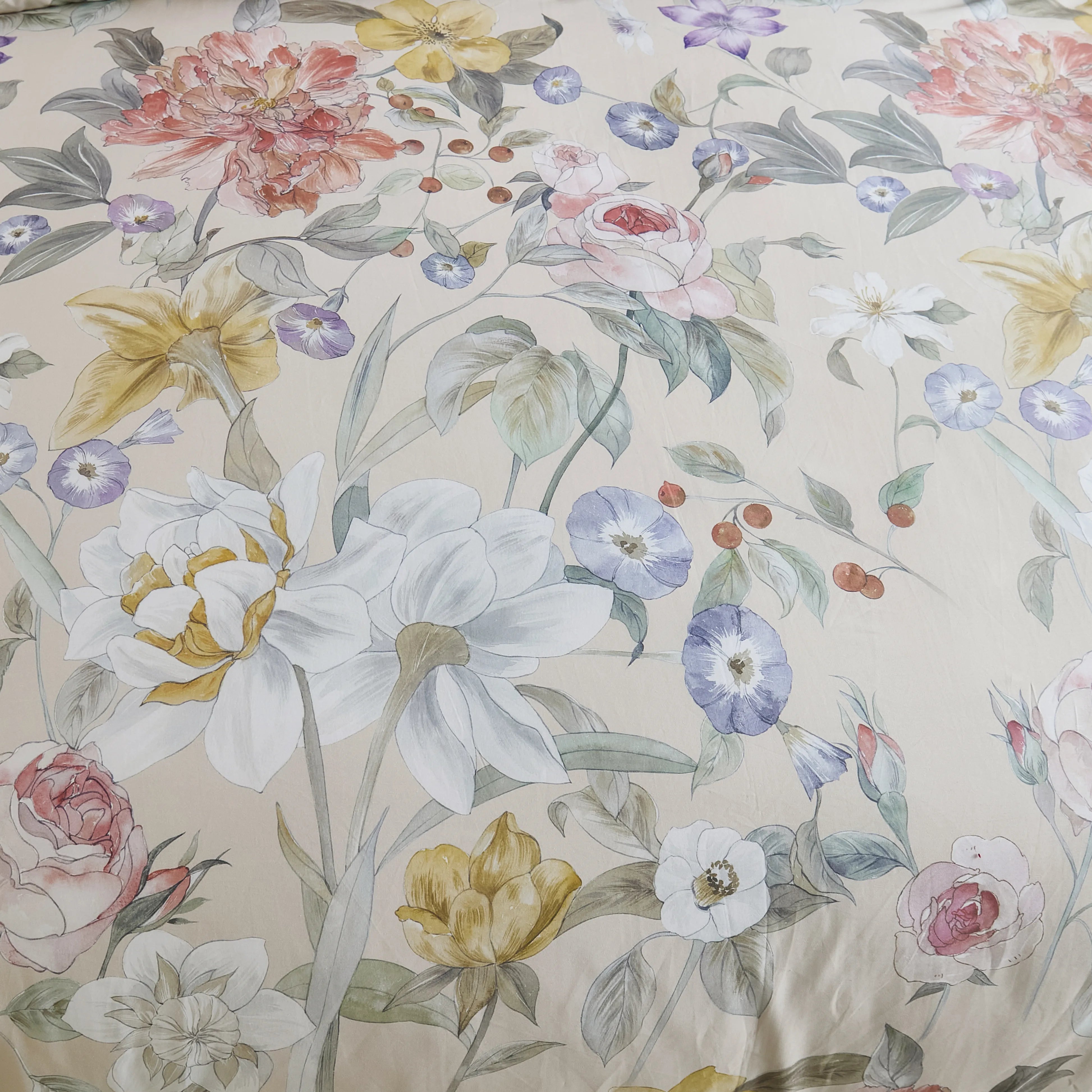 Detailed view of the small, colorful floral pattern on the comforter