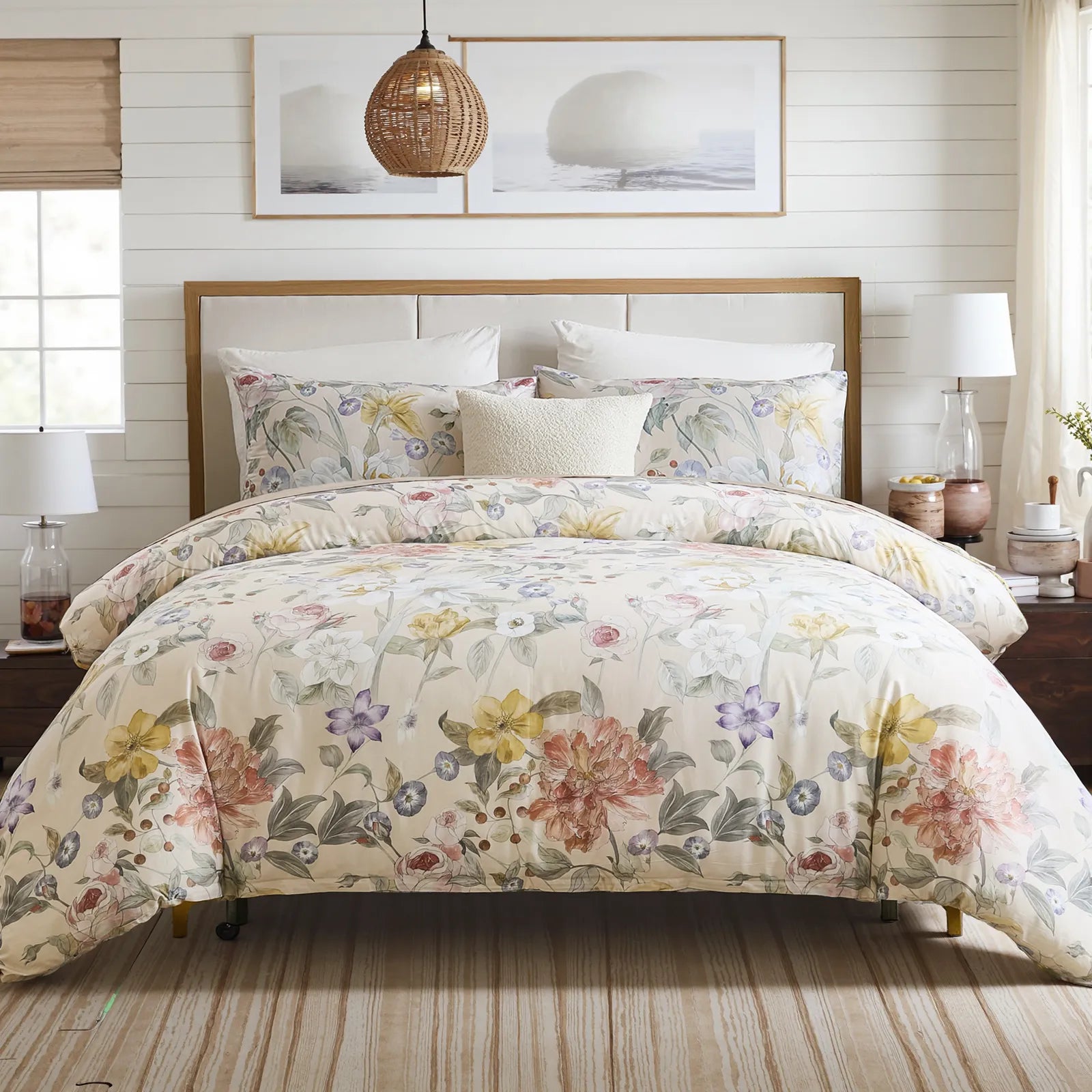 Full view of the spring meadow floral comforter styled on a bed in a bright bedroom