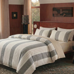 cozy bedroom interior with striped linens