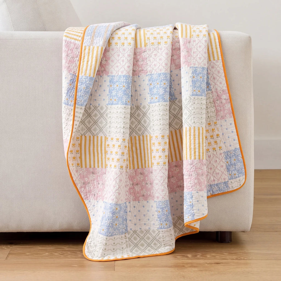 sunday patchwork muslin blanket rainbow patchwork pink blue striped back light grey sofa