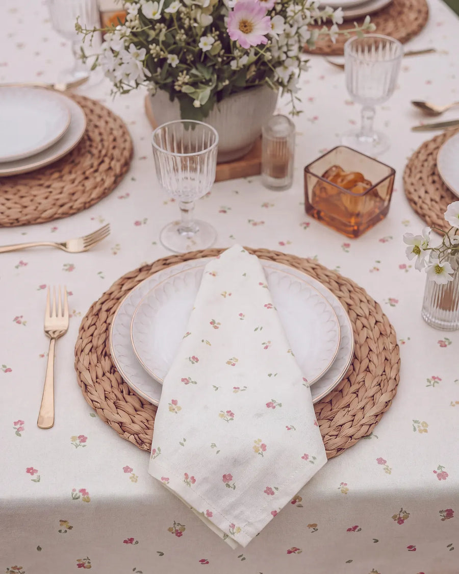 tiny blossom cloth napkin folded on plate top view