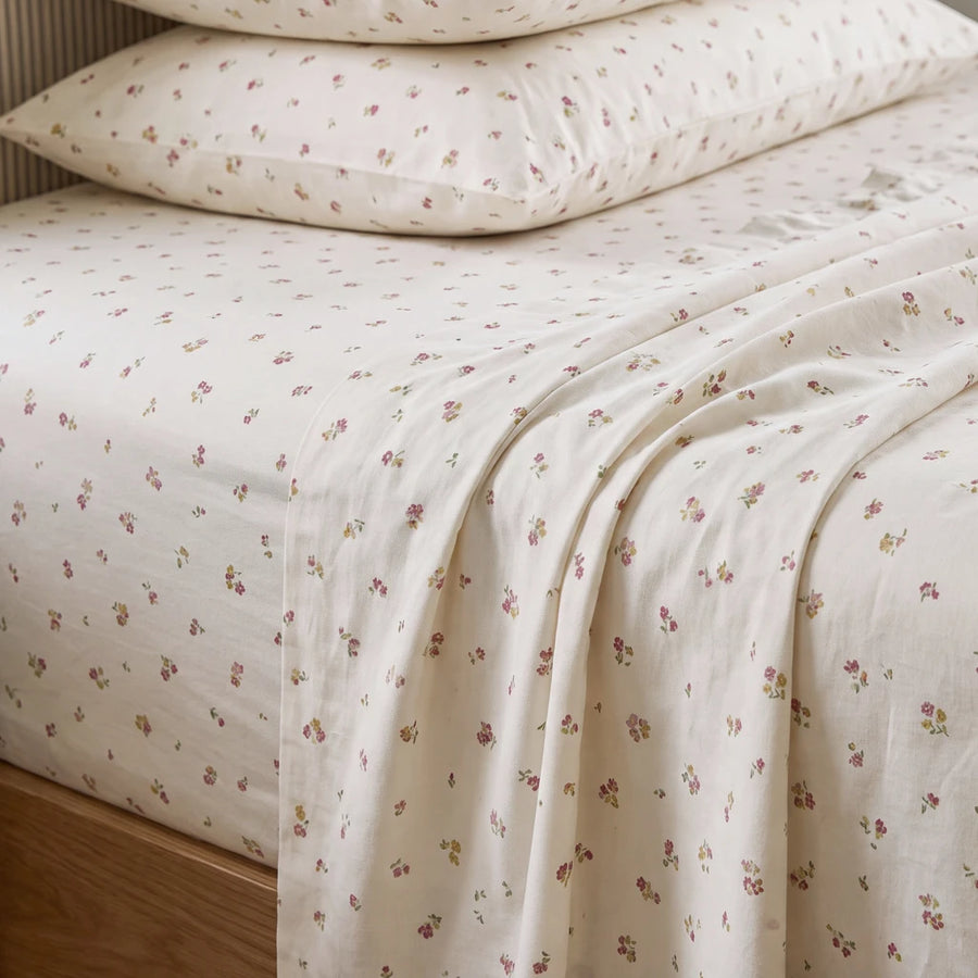 tiny blossom sheet set pillow stack fabric closeup