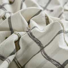 Close up detail of tufted grid cotton fabric