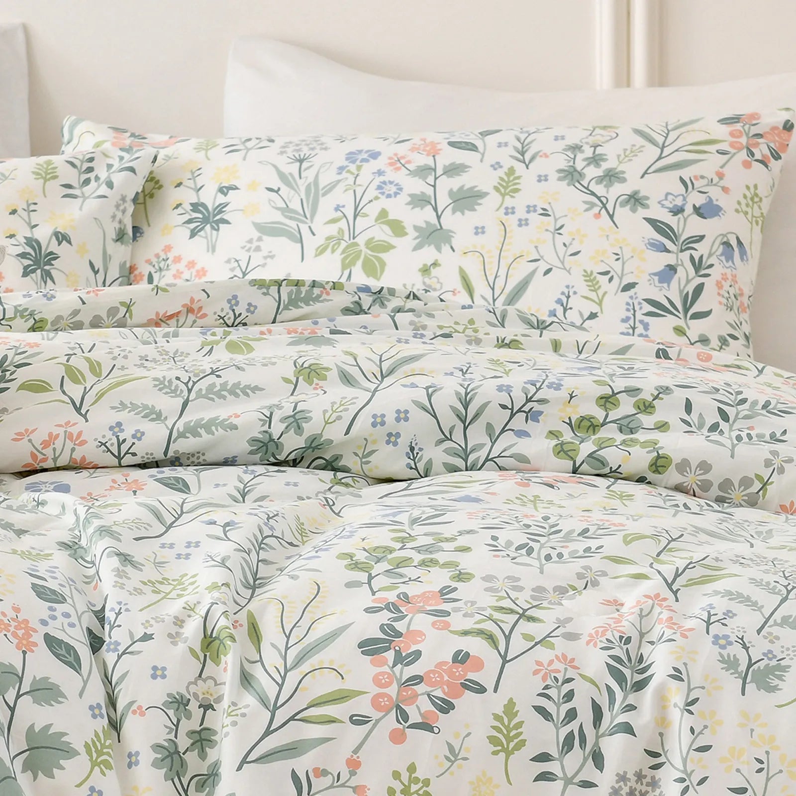 A detailed shot of the fabric texture of the vintage floral duvet cover