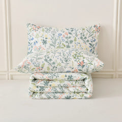 A detailed shot of a folded 100% Cotton Vintage Green Floral comfort set.