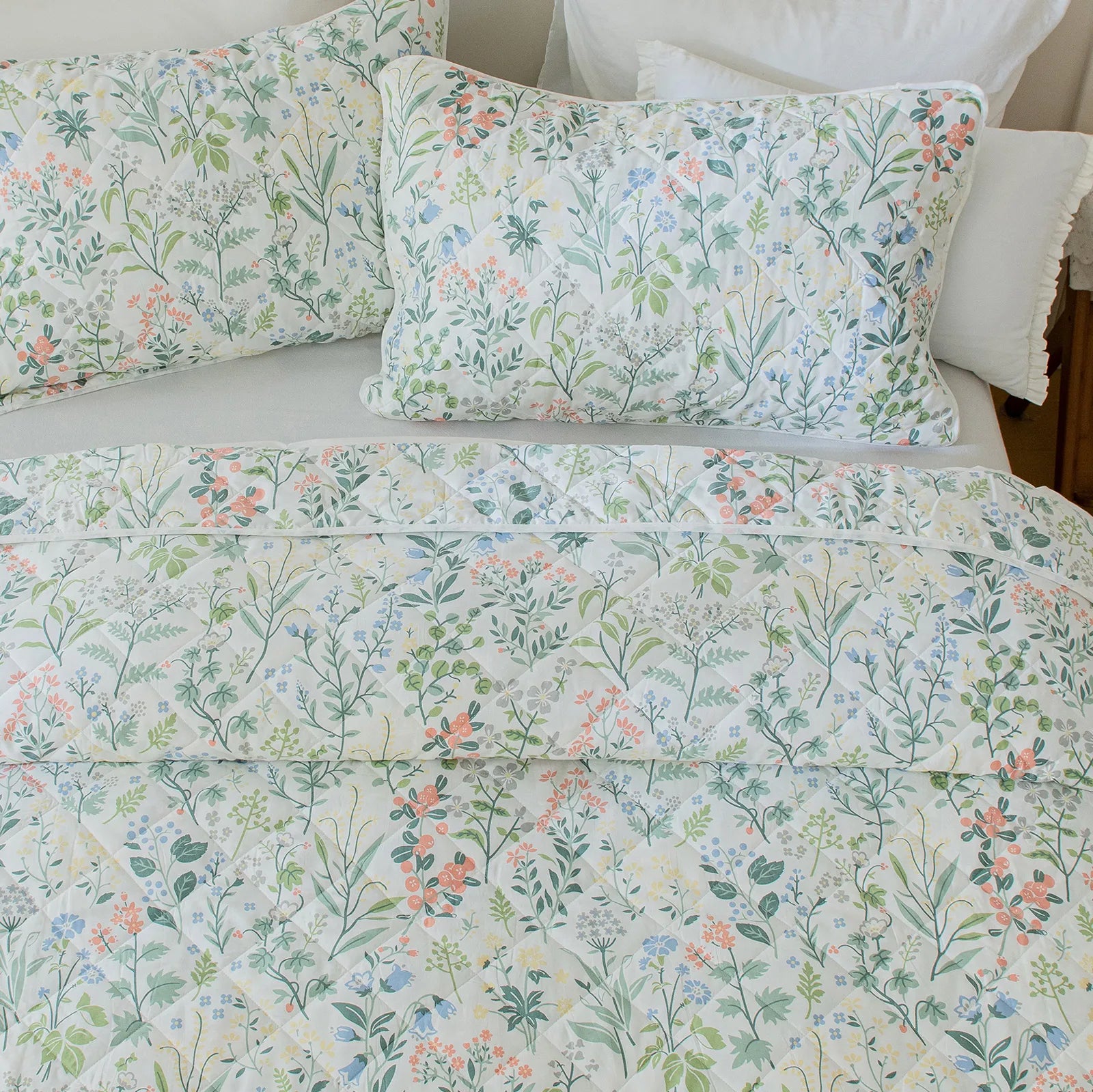 A close-up shot of the intricate vintage floral pattern and stitching