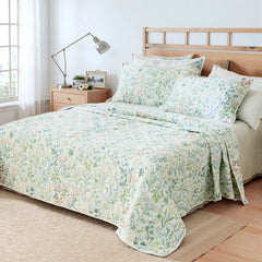 An inviting angled view of the quilt set with matching pillows.