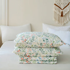The vintage green floral quilt set folded neatly for display