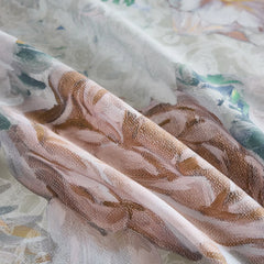 Close up of vintage watercolor floral bedding fabric