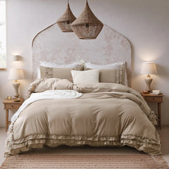 Warm greige ruffled cotton comforter set on a bed