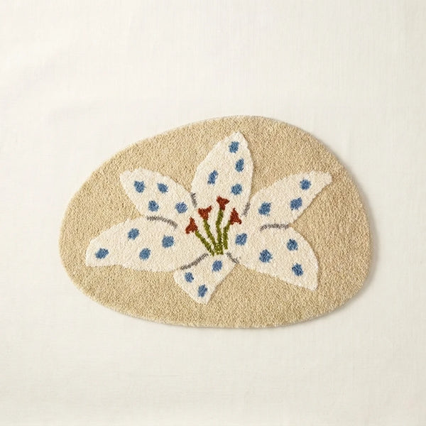 whimsy garden rug lily on sand flat lay product photo