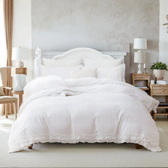 white ruffled cotton comforter set on a bed
