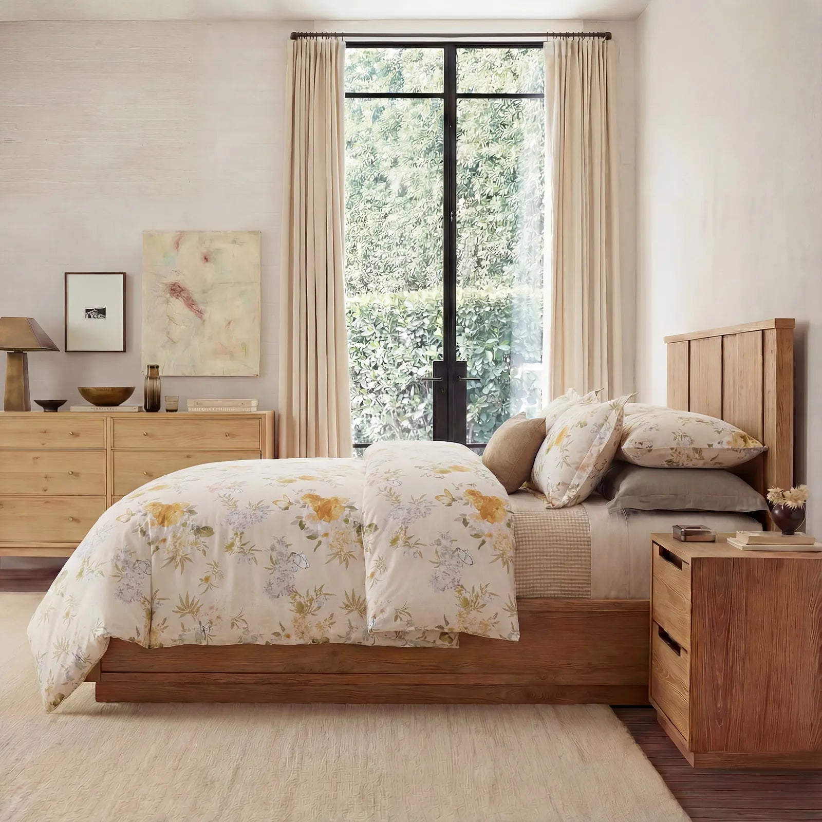 Full bedroom scene featuring yellow botanical bedspread and wooden decor