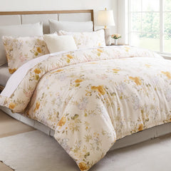 Side shot of the yellow floral comforter set on the bed showing the throw blanket