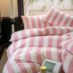 100 cotton cabana stripe pink duvet cover set with candle and book