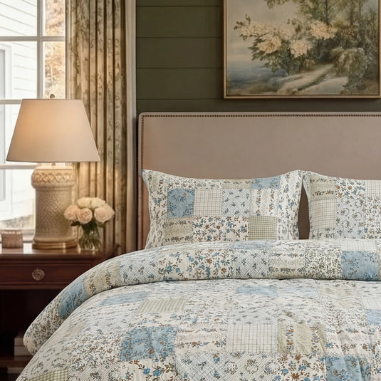 close-up of nostalgic patchwork print cotton pillow shams against a beige headboard
