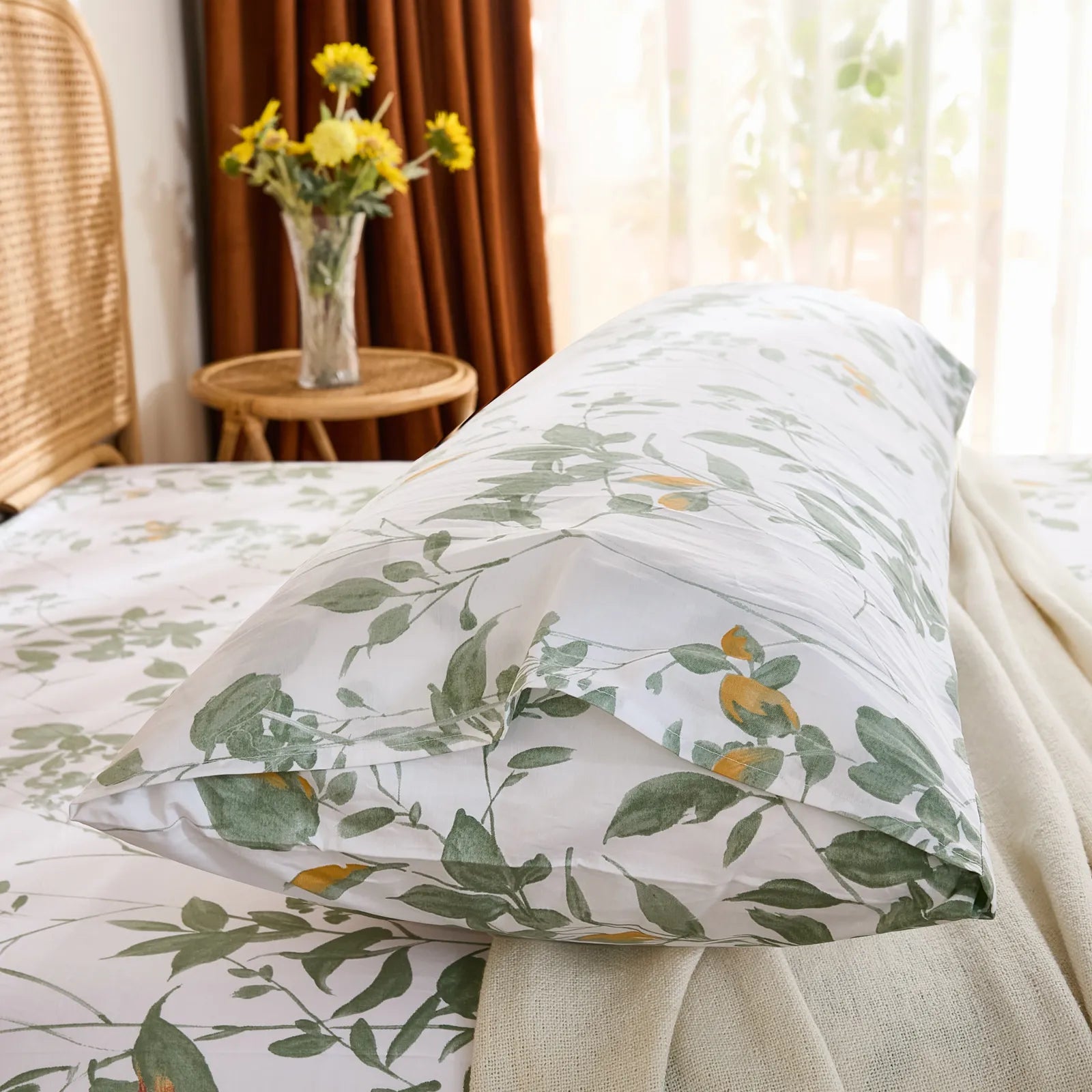Side close-up of the cotton body pillowcase, highlighting the envelope closure detail and green botanical print.