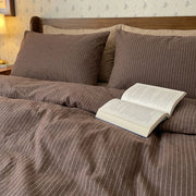 aesthetic dark earth tone striped bedding minimalist scandi style