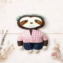 artisan crafted sloth cloth doll flat lay white wood