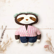artisan crafted sloth cloth doll flat lay white wood