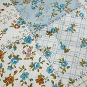 artisanal patchwork fabric texture close up vibrant floral pattern