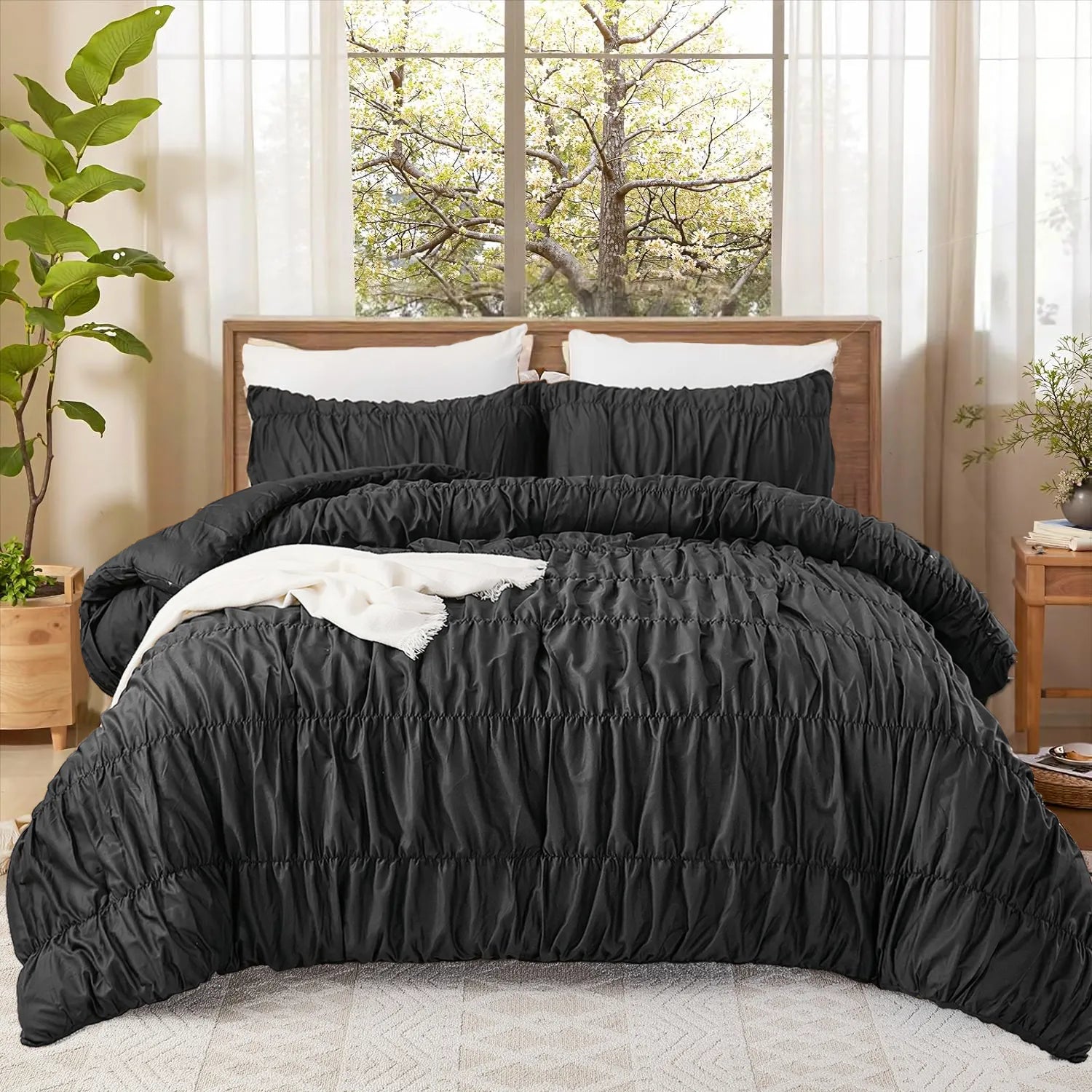 Black cotton crinkle comforter front view with white pillows