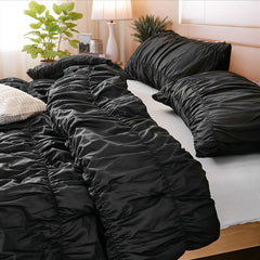 Black cotton crinkle comforter headboard closeup