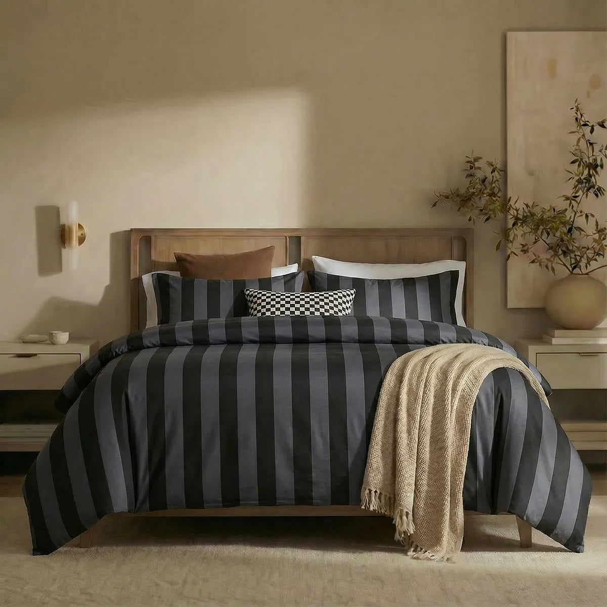 Full front view of black and grey striped bedding set